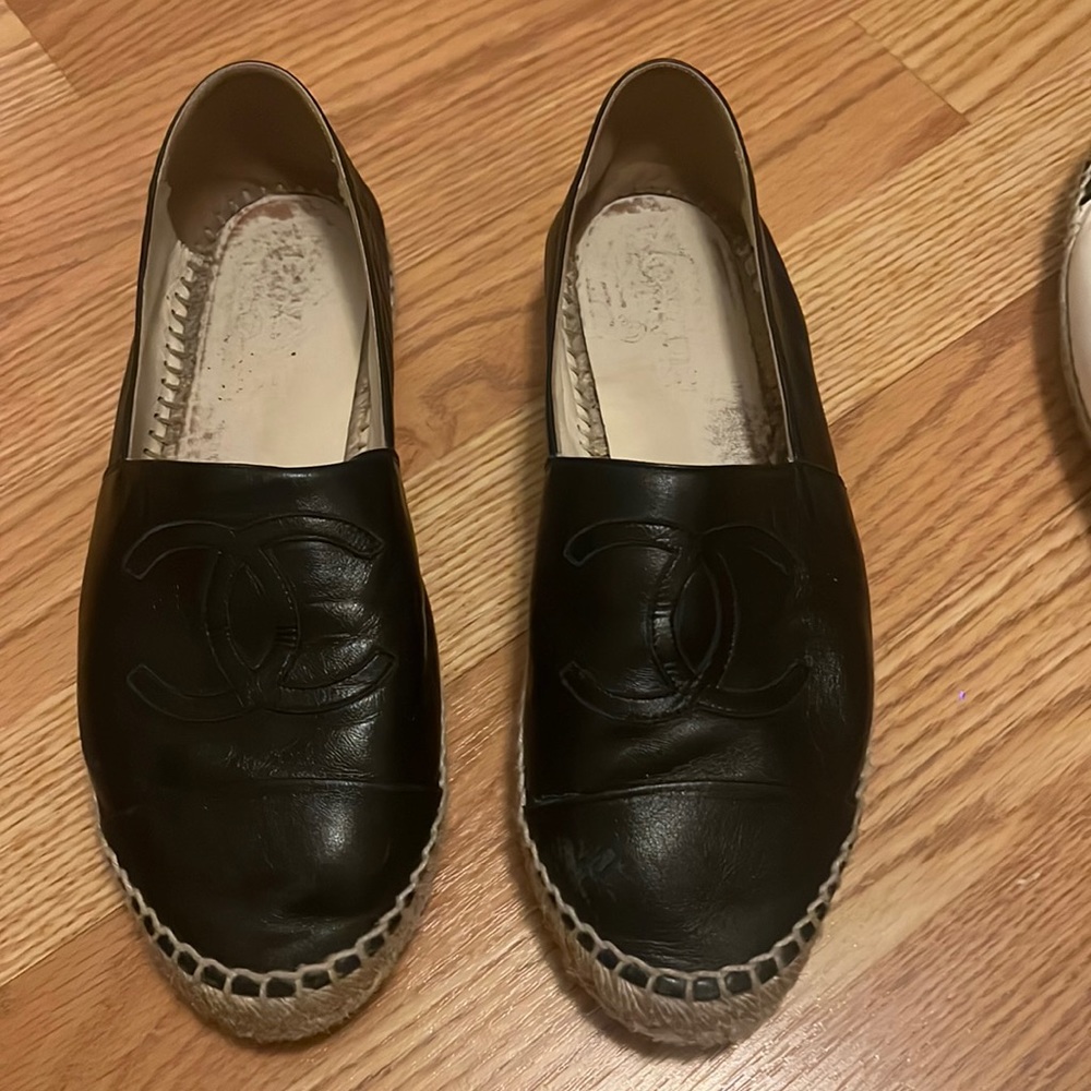 Black leather Chanel slip Ons